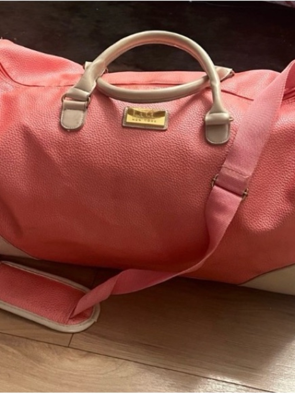 Nicole by Nicole Miller $249
vegan leather duffle travel bag. Peach